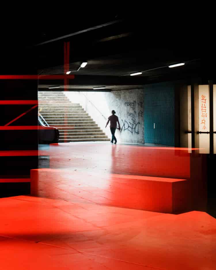 the exit - silhouette stepping through bright doorway in palma old town